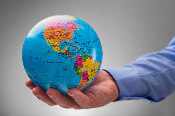 istock Businessman holding the world in his hands 504013120