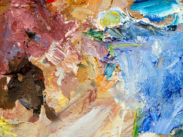 istock Colourful artists oil paint palette full frame texture background 504016886