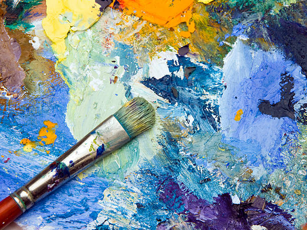 istock Artists palette and paint brush 504017164