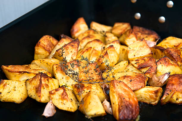 istock Baked potatoes with herbs. 504017180