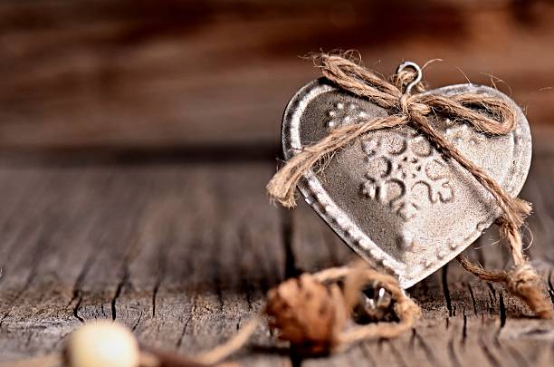 istock Silver heart on a wooden table with decorations. Valentines day. 504017236