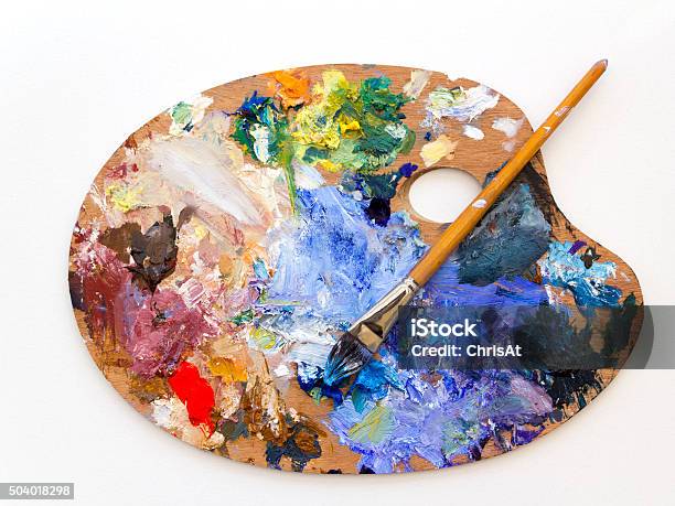 Colourful Artists Oil Paint Palette And Brush On White Stock Photo - Download Image Now