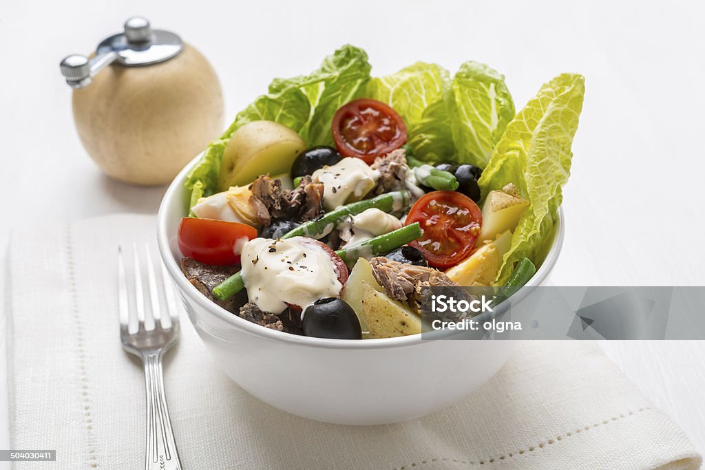 Nicoise Salad Bowl of Healthy Nicoise Salad on White Background Appetizer Stock Photo