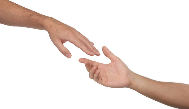 istock Two male hands reaching towards each other. Isolated 504030883
