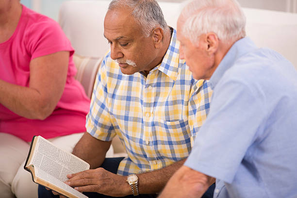 istock Senior adult men during bible study group. 504031437