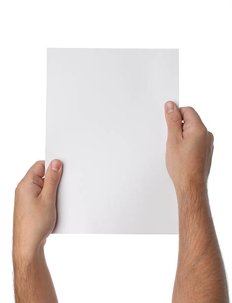 istock Male hands holding blank paper isolated 504032635