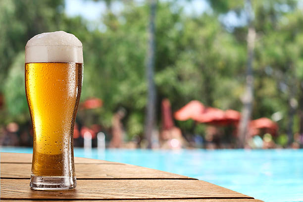 Beer glass on the bar table at the open-air cafe.