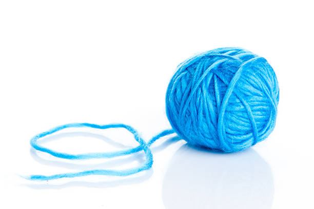 istock Blue wool yarn ball isolated on white 504034711