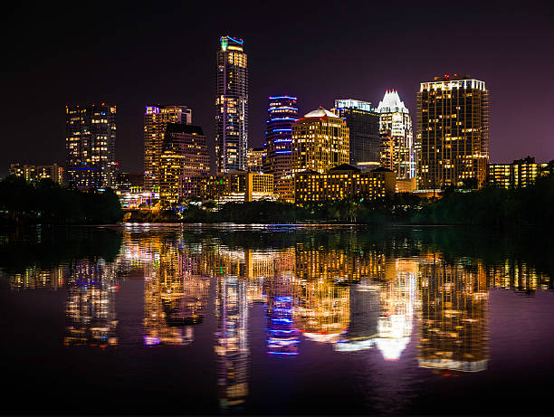istock Austin Texas skyline cityscape reflection over Ladybird Lake at night 504034795