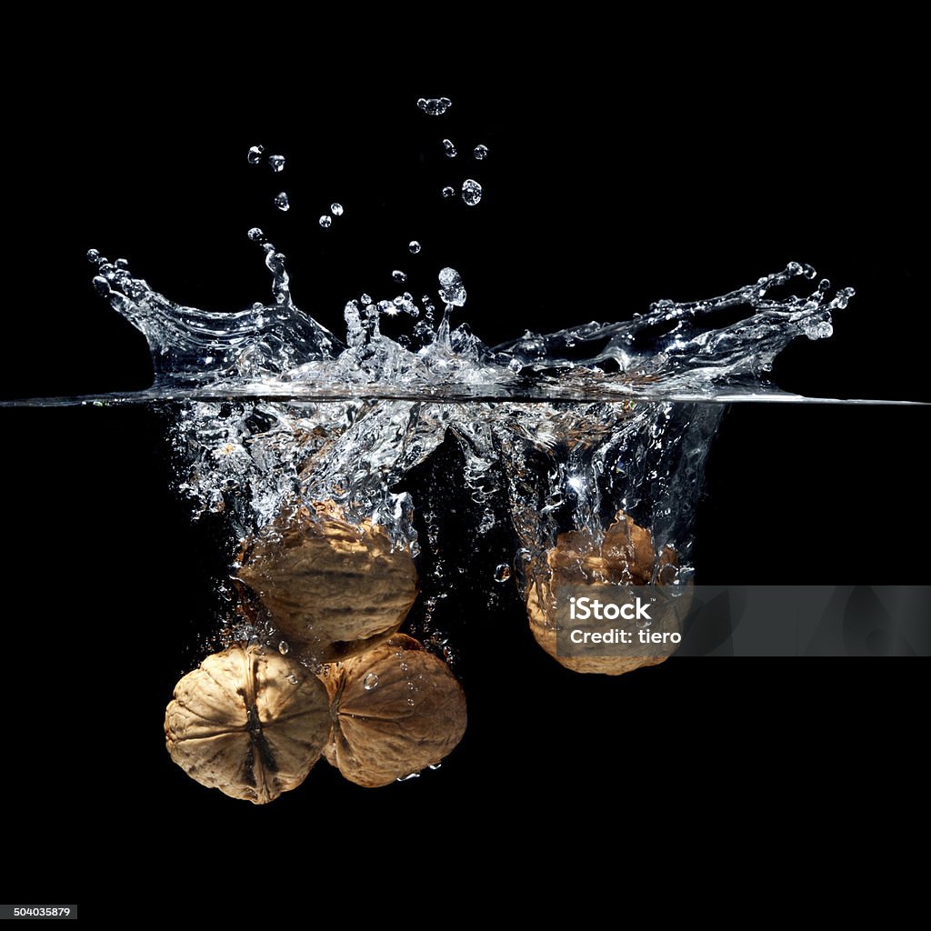 walnuts splash high speed photography walnuts splash in water Cold Drink Stock Photo