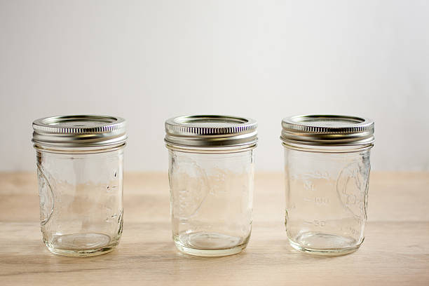 istock Empty canning jars on a wooden tabletop. 504036067