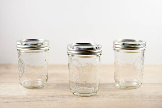 istock Empty canning jars on a wooden tabletop. 504036075