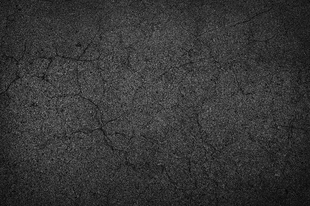 istock background texture of rough asphalt crack 504036422