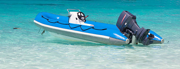 istock Inflatable boat moored at the blue sea 504036968