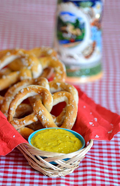 istock Pretzels Mustard and Beer Stein on Red Checker Tablecloth 504037052