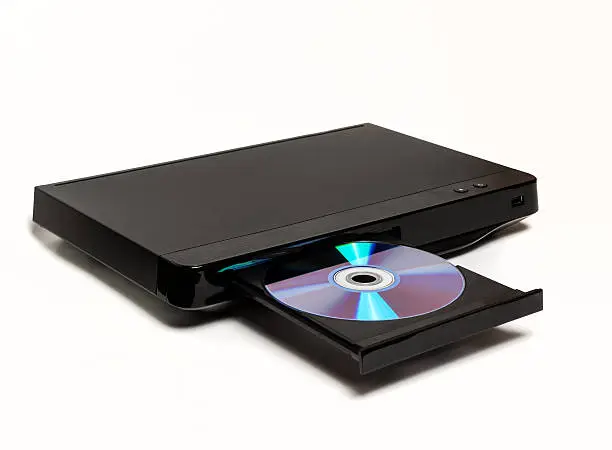 Photo of Black DVD/CD player with open tray and CD disk isolated