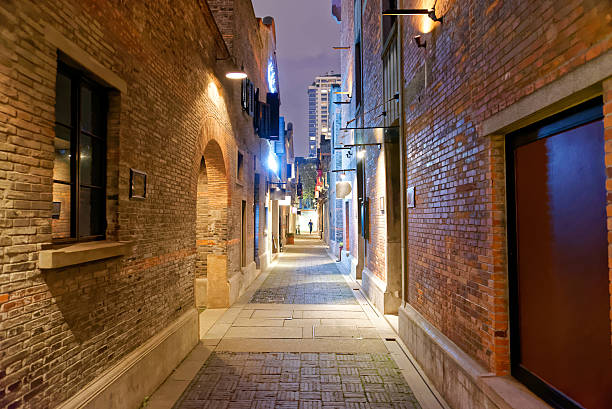 istock Empty street in the nigh with brick walls 504037946