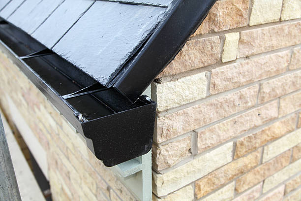 istock roof guttering on new house 504038534