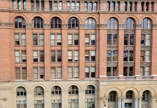 istock Facade of brick building with windows and arches 504038934