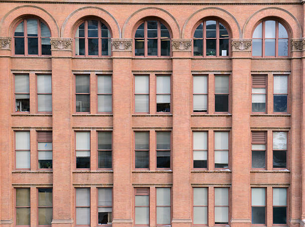 istock Facade of brick building with windows and arches 504038988