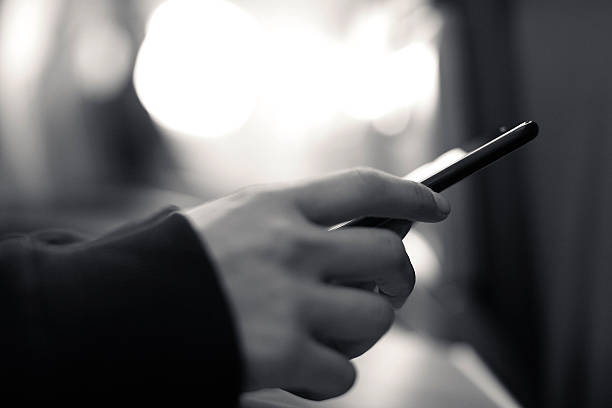 istock Woman using smartphone in airplane during flight 504040512