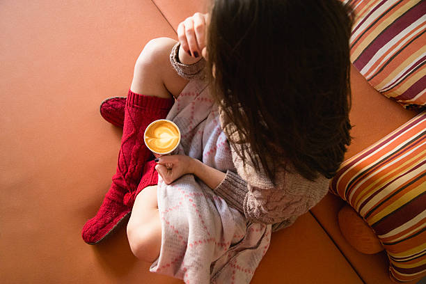 Girl in bed with coffee cup