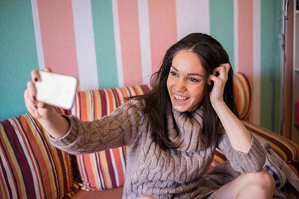 istock Girl in bed posing for self portrait 504042842