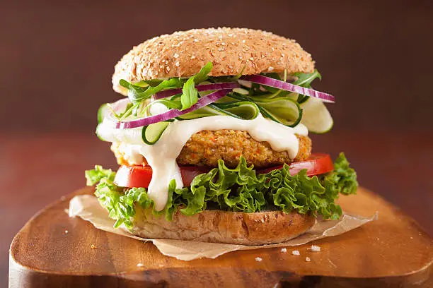 Photo of veggie carrot and oats burger with cucumber onion
