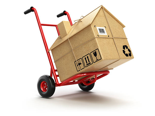 Delivery or moving houseconcept. Hand truck with cardboard box a Delivery or moving houseconcept. Hand truck with cardboard box as home isolated on white. 3d relocation stock pictures, royalty-free photos & images