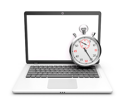 Laptop with stopwatch on a white background.