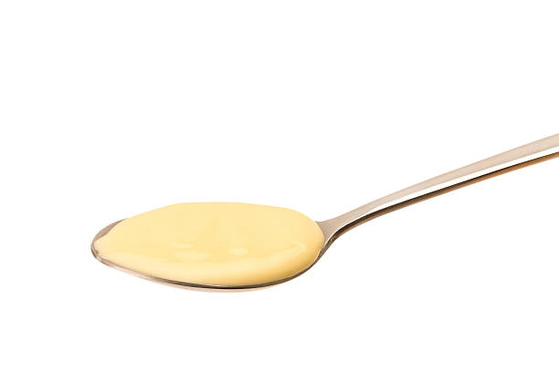 istock Spoon full of custard 504044802