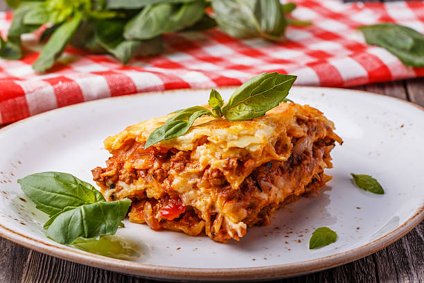 Traditional lasagna made with minced beef bolognese sauce Traditional lasagna made with minced beef bolognese sauce and bechamel sauce  topped with basil leaves. bolognese sauce photos stock pictures, royalty-free photos & images
