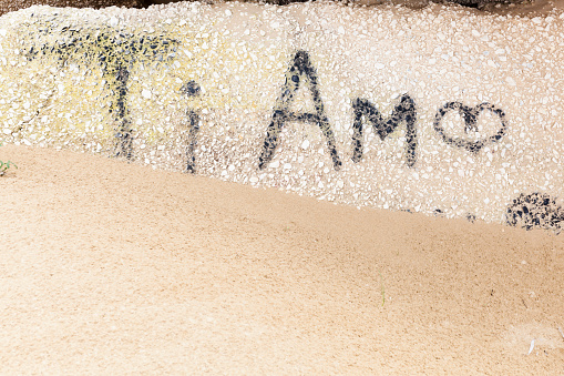 Ti Amo, i love you, painted on stone on Italian beach.