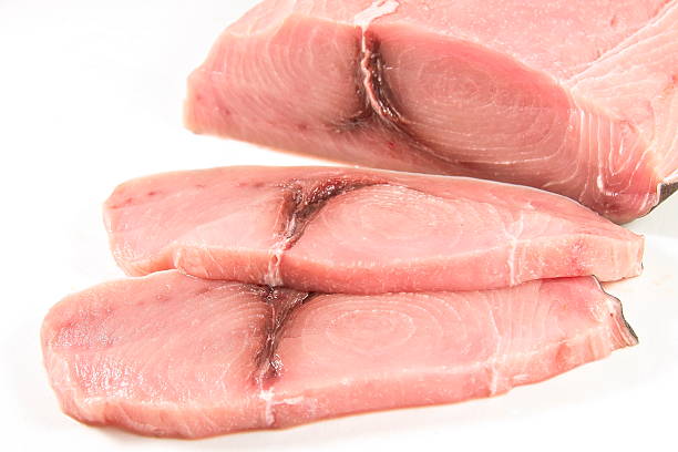 istock Sliced fillet of swordfish, white background. 504045630