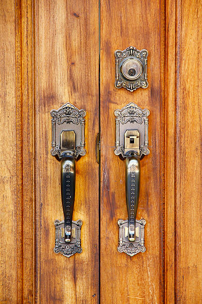 istock Stock Photo: Door handles with an old double door. 504046584