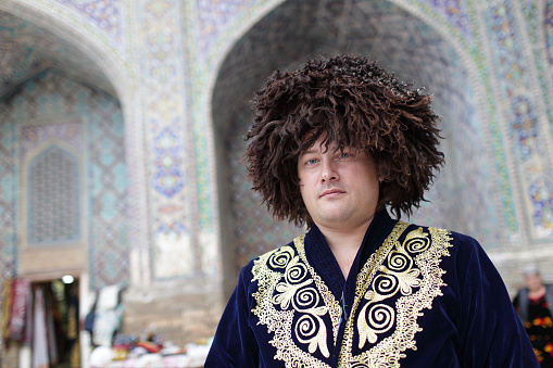 The tourist poses in uzbek clothes, Uzbekistan, Samarkand