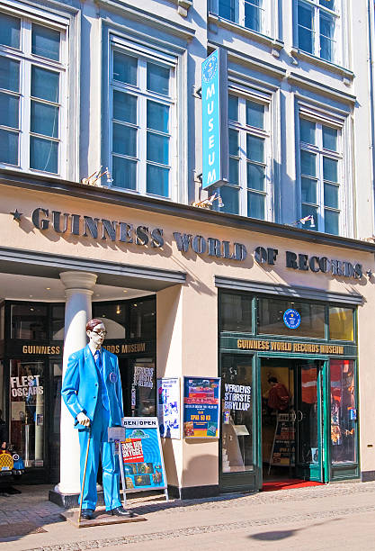 Copenhagen. Denmark. The Guinnes World Records Museum Copenhagen, Denmark - April 13, 2010: The Guinness World Records Museum. Near the entrance is sculpture of the tallest man in the world Robert Pershing Wadlow (272 cm.) guinnes stock pictures, royalty-free photos & images