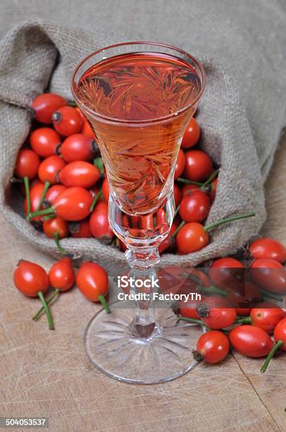Rosehip Fruit And Alcoholic Liquor Stock Photo - Download Image Now - Rose Hip, Fruit, Alcohol - Drink