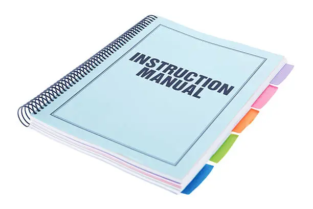 Photo of Instruction Manual - Bound Paperwork Document on White