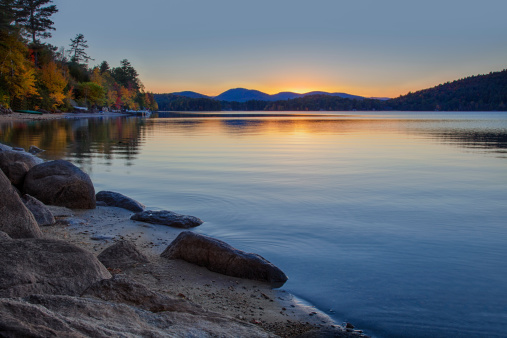 A warm glow shortly after sunset creates a peaceful scene at Schroon Lake in the Adirondacks of New York State. More:
