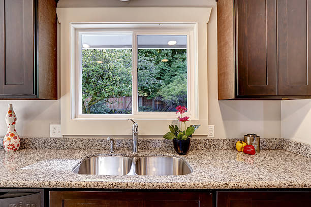 istock Kitchen cabinet with sink and window view 504056473