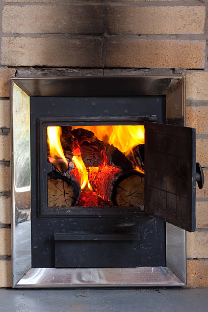 istock burning wood in a stove 504056585