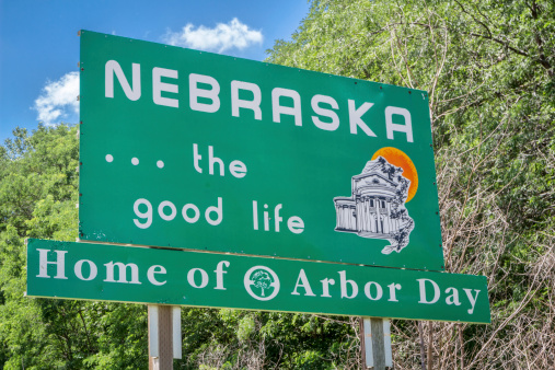 Plattsmouth, NE, USA - July 13, 2014: Nebraska, the good life, home of Arbor Day - roadside welcome sign at state border
