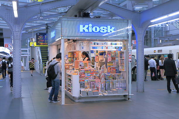 Osaka, Japan - 3 June, 2014: Commuters shop at Kiosk at JR Osaka Train station in Osaka Japan.