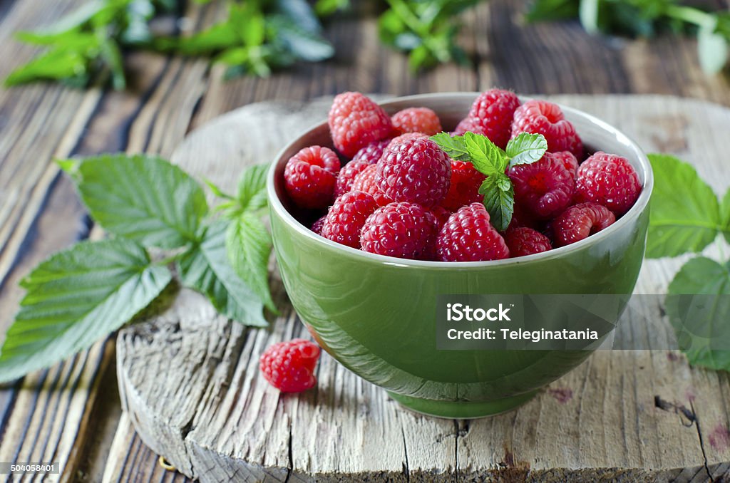 Fresh raspberries in a bowl Backgrounds Stock Photo