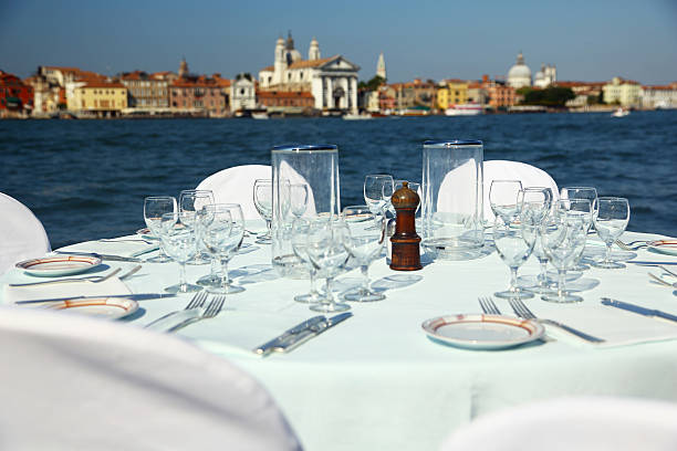 istock Table prepared with the stunning backdrop of Venice 504059519