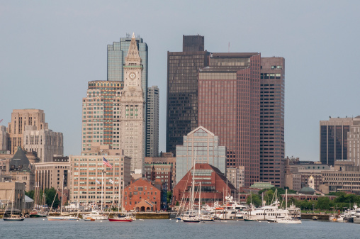 Boston, Massachusetts, USA-July 26, 2014: Skyscrapers in downtown Boston along the waterfront. One tall building is the city's historic Custom House.