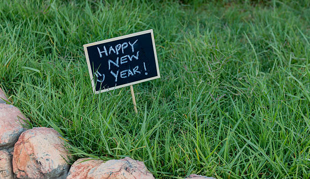 Happy New Year written on black chalkboard stock photo