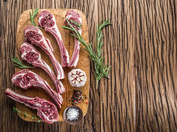 istock Raw lamb chops with garlic and herbs. 504068916