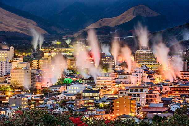 Beppu, Japan Onsens Beppu, Japan cityscape with hot spring bath houses with rising steam. kyushu photos stock pictures, royalty-free photos & images